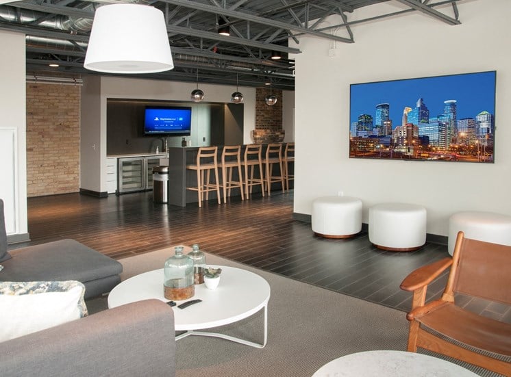 Community Room with Bar, Televisions and Seating Area at 700 Central Apartments, Minneapolis, MN